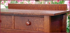 Detail of the authentic turned wooden handle and the excellent hand-selected quarter-sawn oak grain. (The top two drawers on this highboy were ordered with optional locks at an additional cost). 